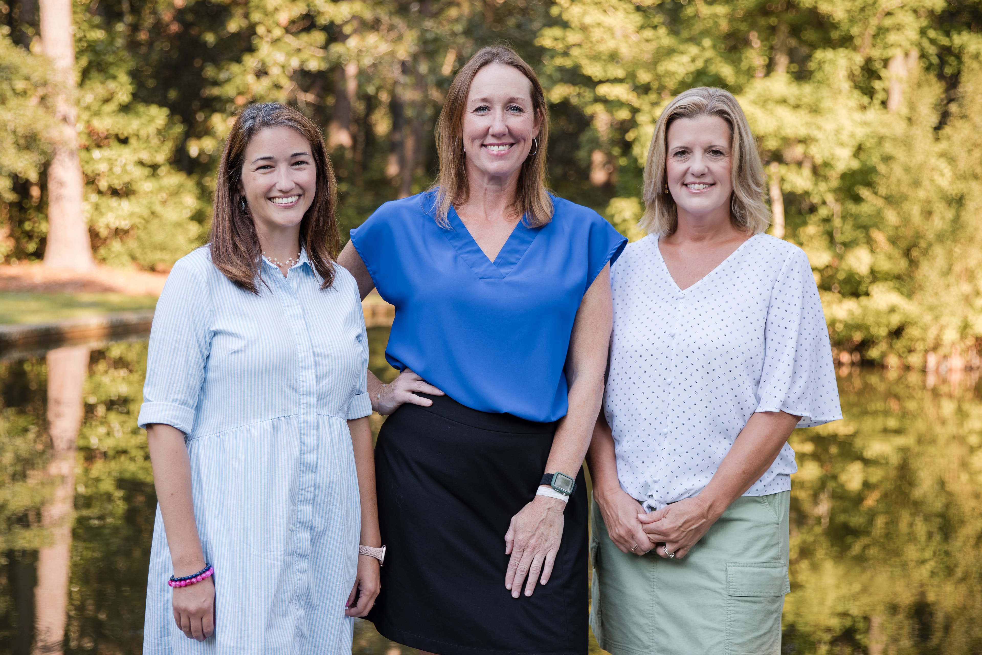 Lindsey Draugel, Ashley Figueiredo, and Kelli Roberson standing together outdoors